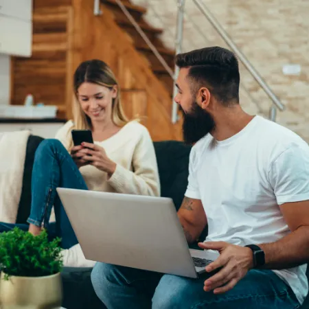 Foster parents researching more foster care resources on the Kidz Thrive website.