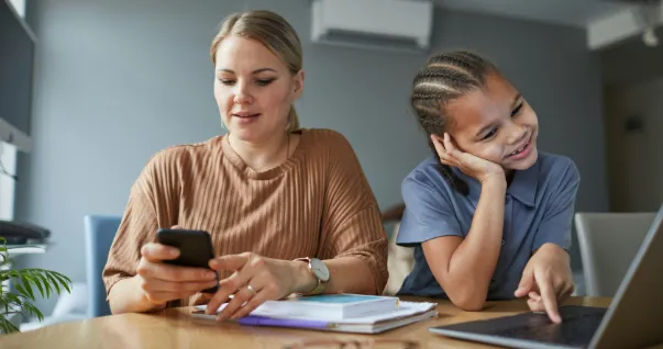 A foster parent with foster care teen researching the Kidz Thrive resources page.