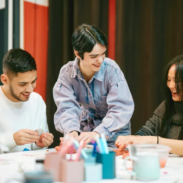 Community organizer working with Kidz Thrive partners and local businesses at an event.