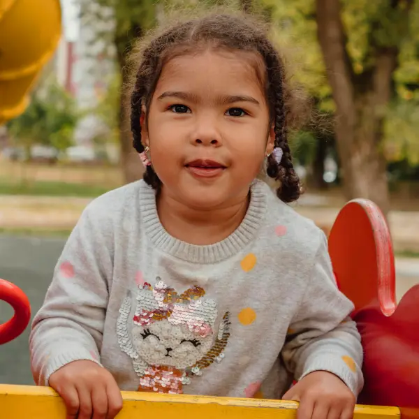 Adoptive child playing at the park.